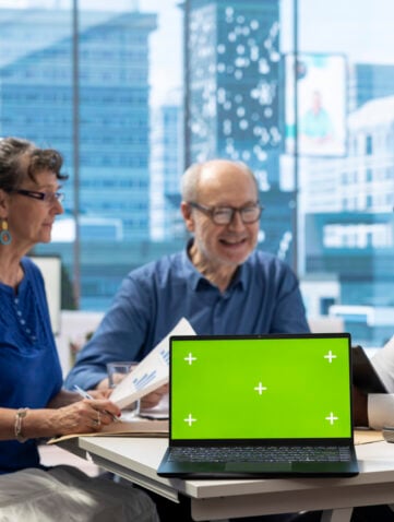 Banker guiding senior couple in choosing the right retirement plan