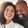 A happy couple embracing and laughing